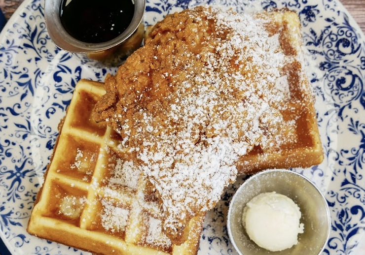 Tupelo Honey Southern Kitchen & Bar Restaurant in Huntsville, AL signature dishes Dark Meat Fried ChickenHeavenly Banana PuddingClassic Chicken and Waffles